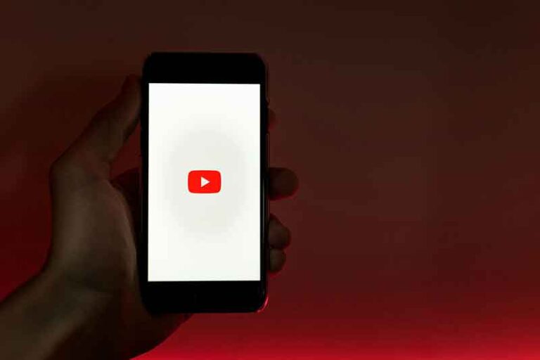 A smartphone displays the YouTube logo against a red backdrop, highlighting the rise of YouTube Shorts and vertical video content in today’s SEO landscape.