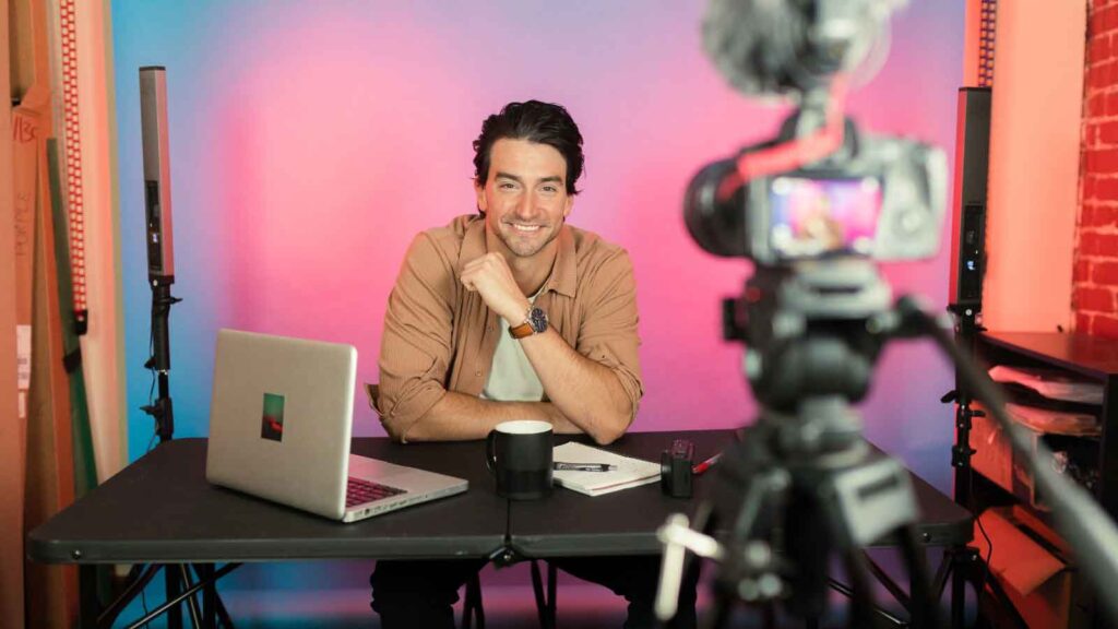 Content creator recording a video in a home studio setup.