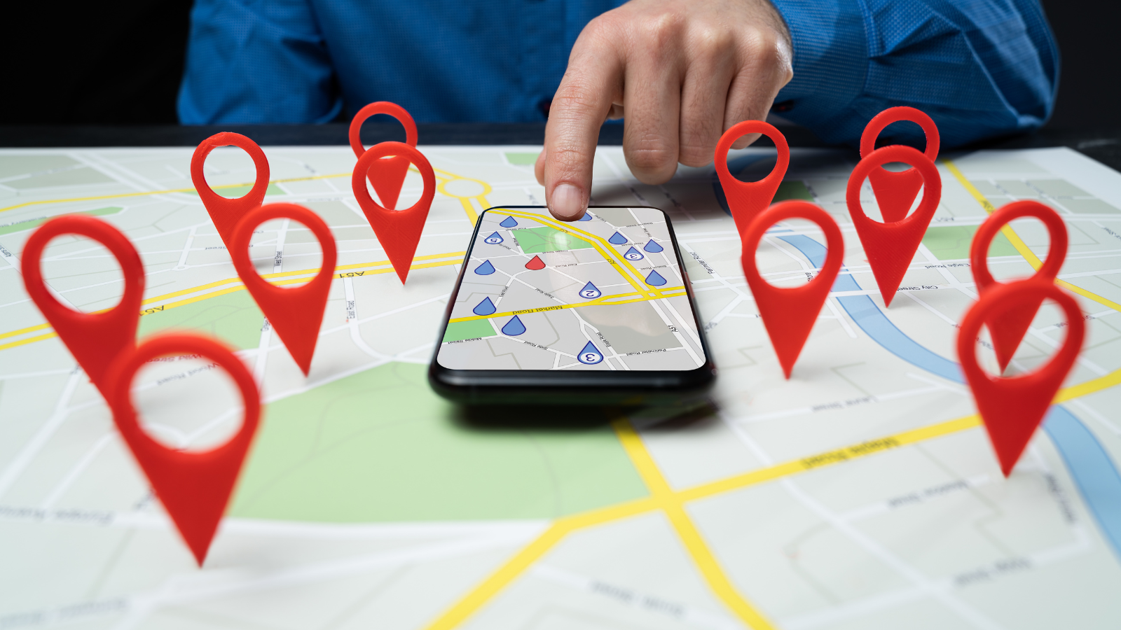 Person-uses-smartphone-map-surrounded-by-location-markers.