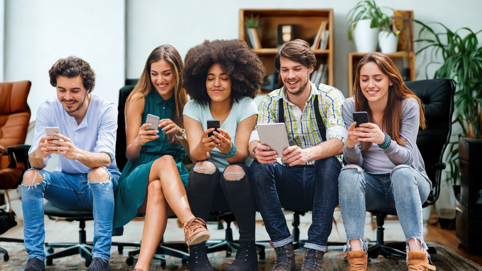 Group of young professionals browsing citation sites for local business on mobile devices