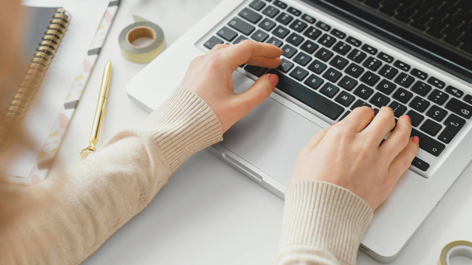 Marketer creating local content posts on a laptop