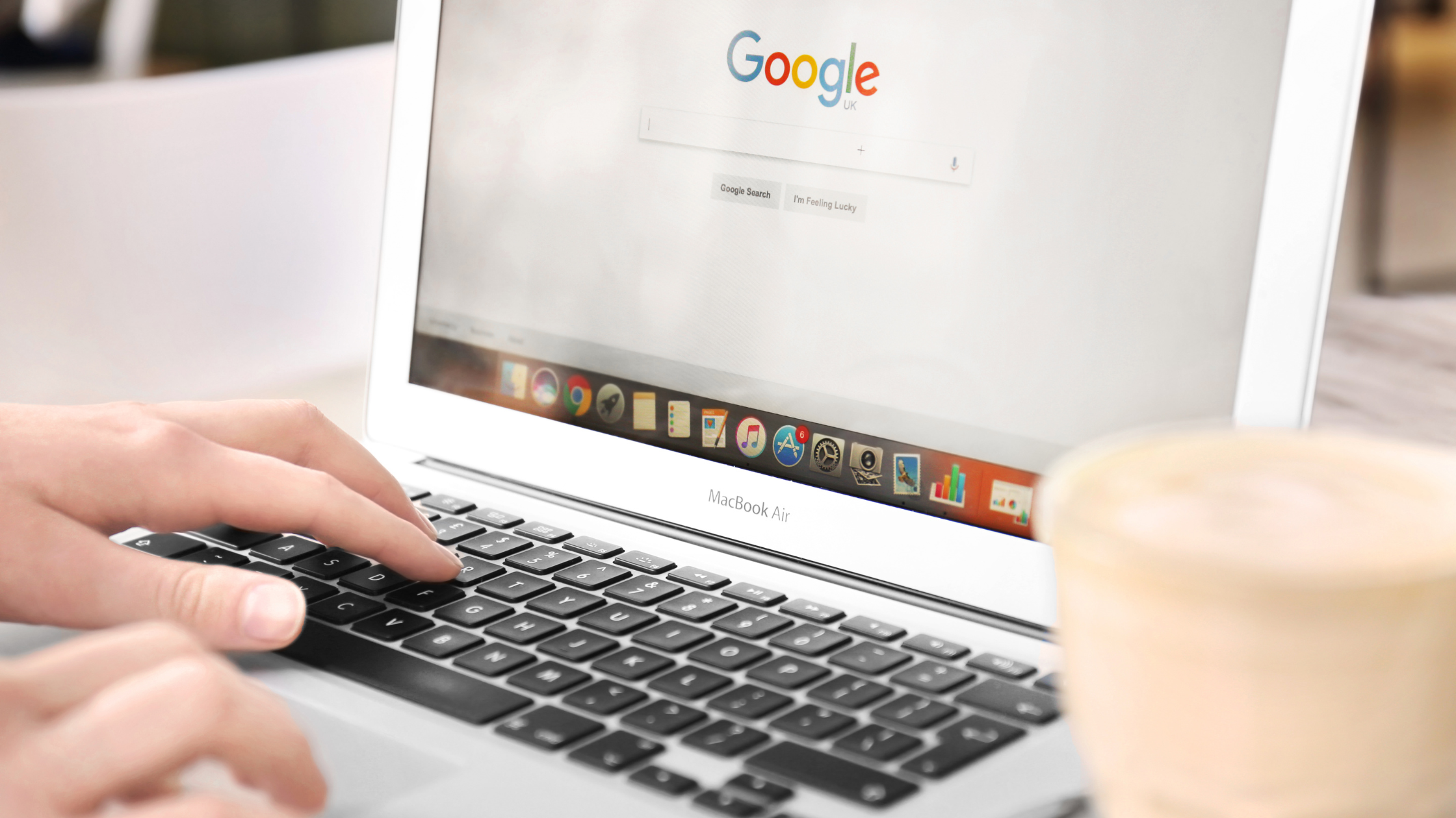 Close-up of a laptop displaying the Google search page