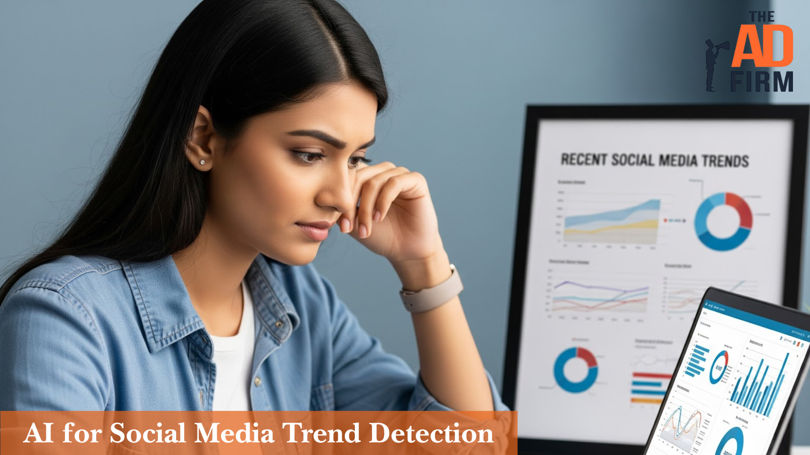 Woman analyzing charts on her computer and a nearby display labeled “Recent Social Media Trends,” showing graphs and pie charts, representing AI-powered trend detection.