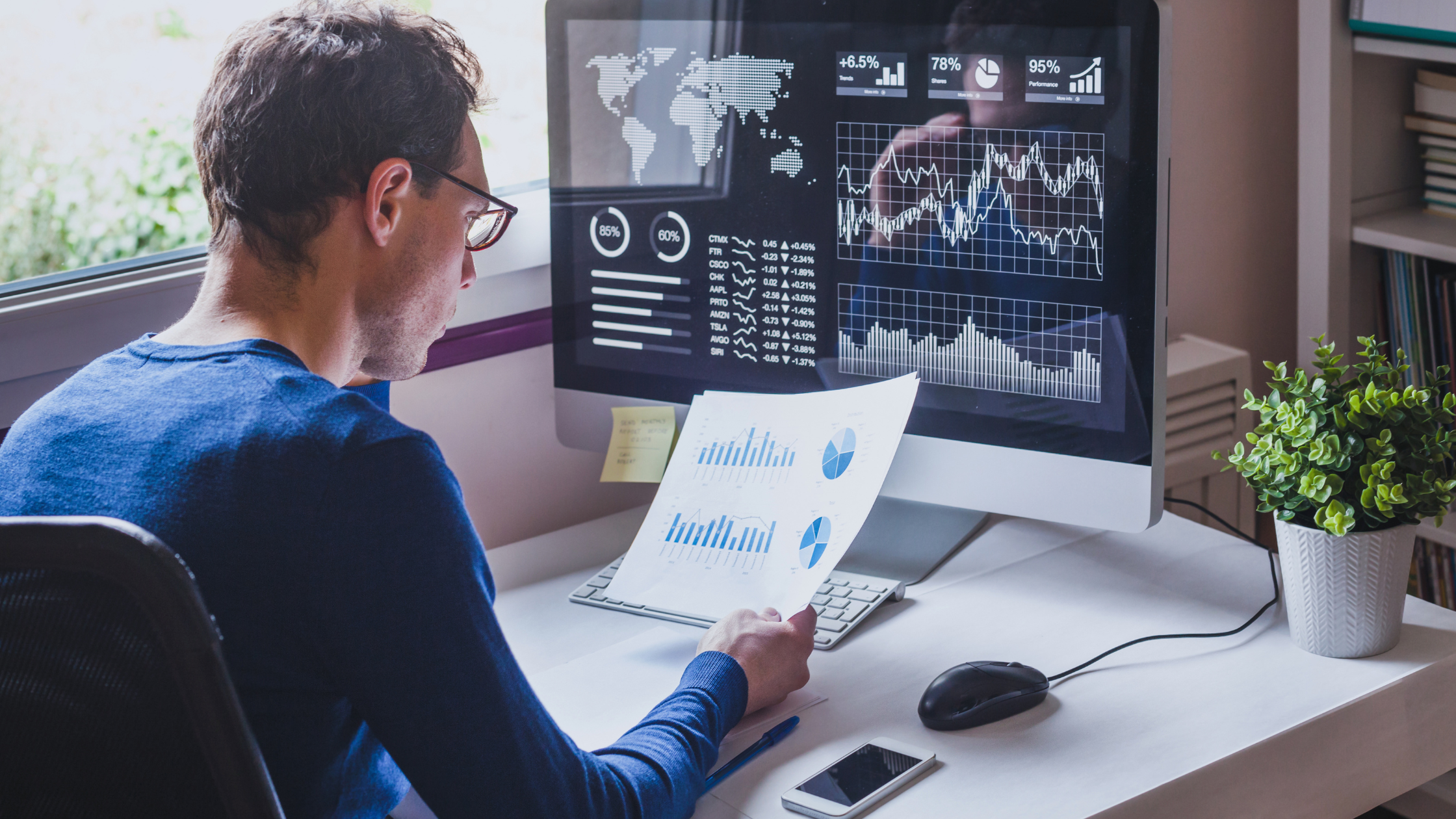 A man analyzing an SEO audit on a computer screen