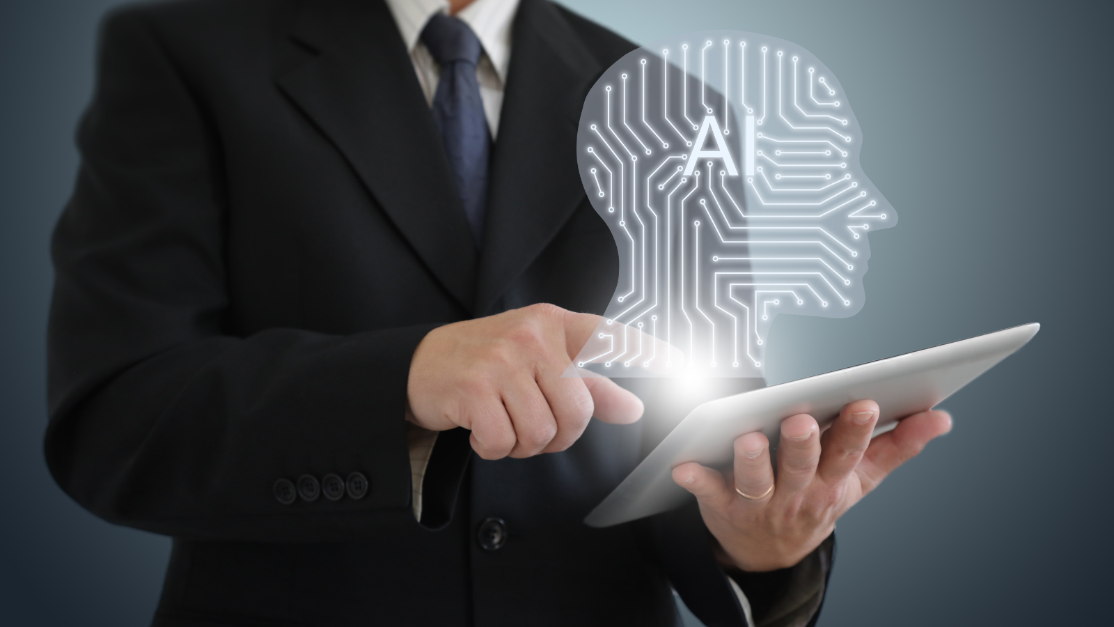 Businessman using a tablet with an AI digital head hologram