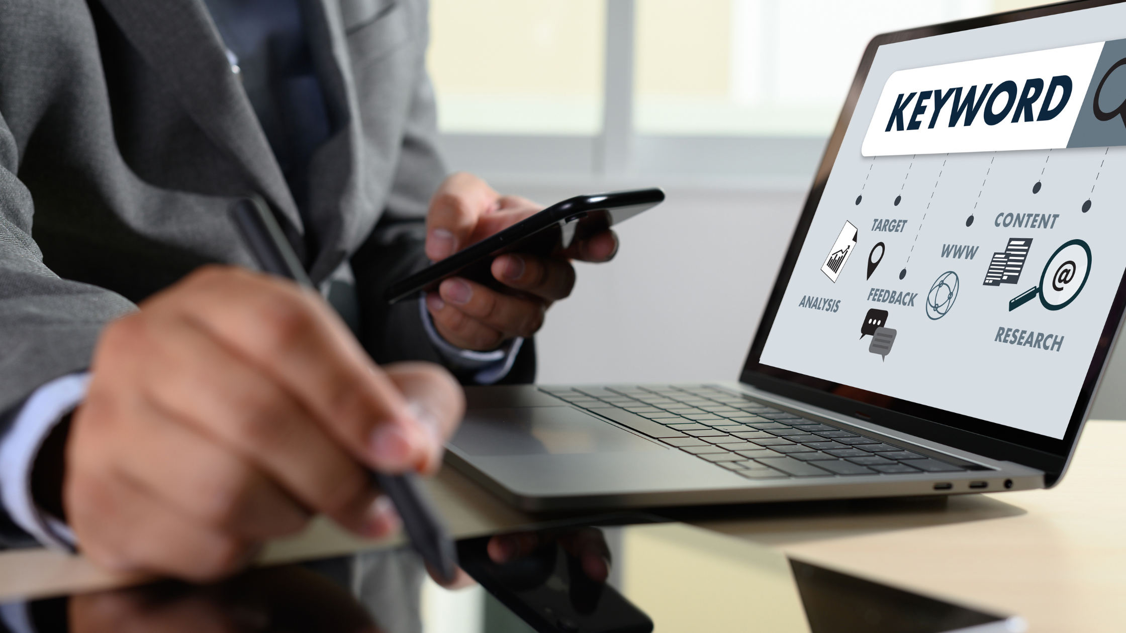 A man on his computer screen showing keyword rankings