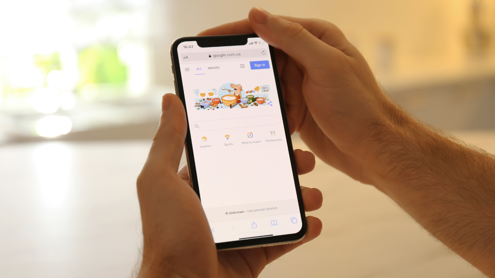 Person browsing Google on a smartphone