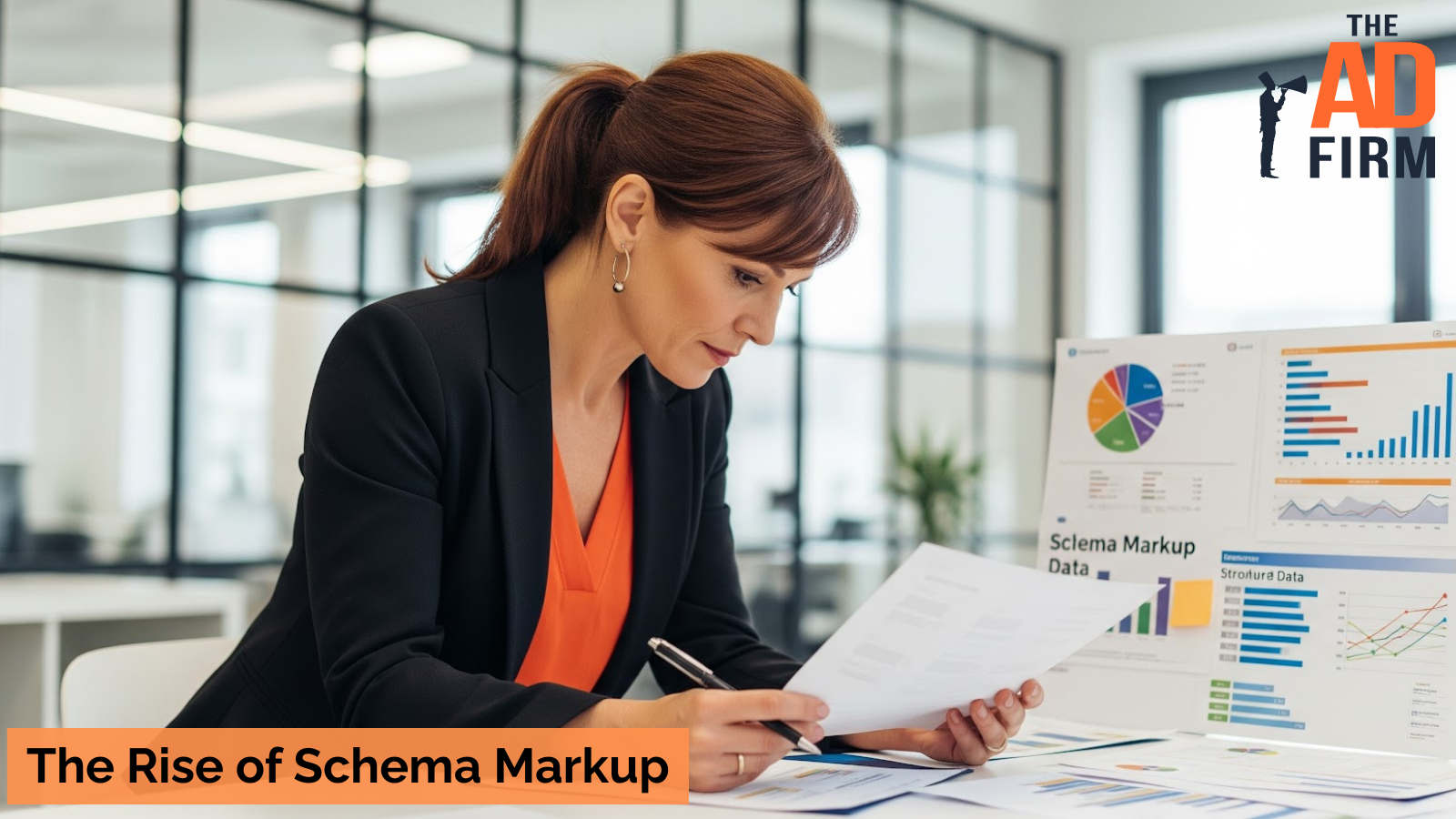 A marketing professional reviewing schema markup data and analytics in a modern office, with charts and graphs displayed on a presentation board.