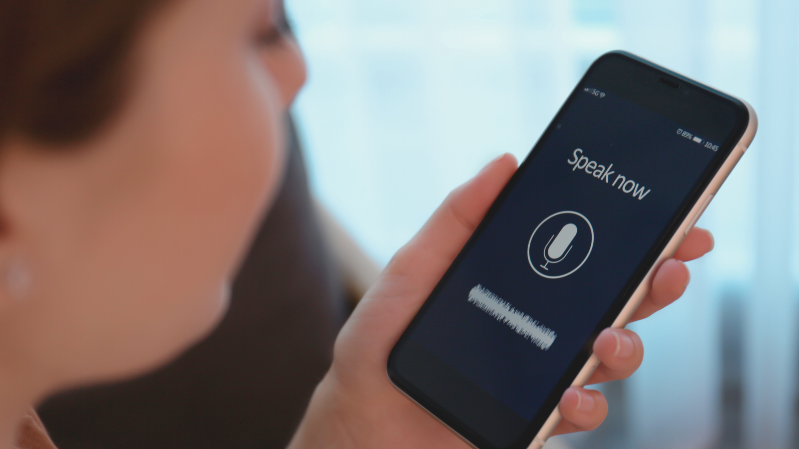 Voice search optimization on smartphone displaying ‘Speak Now’ prompt and microphone icon. 