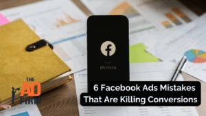 Smartphone with Facebook logo and business charts