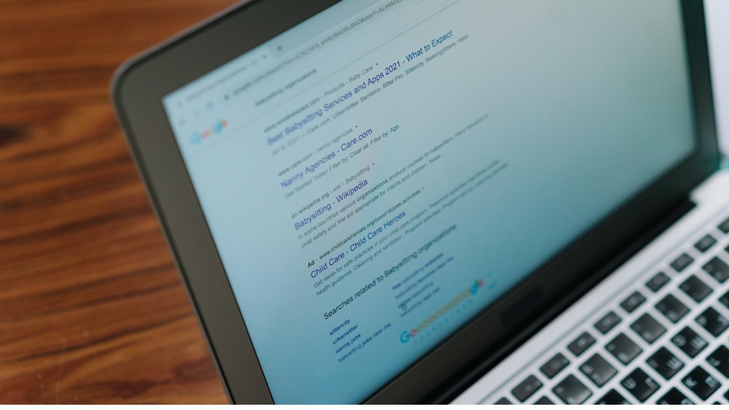 Laptop placed on a table in a clean workspace setting.