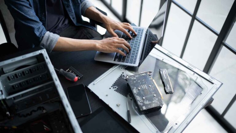 Computer technician upgrading hardware