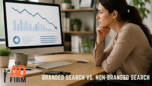 Woman reviewing a declining analytics chart on her computer